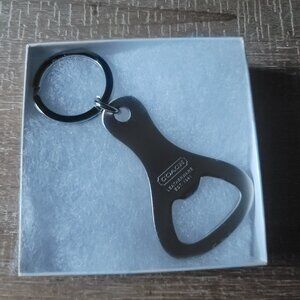 COACH Brushed Nickel Real Bottle Opener Keychain.  Brand new. Gift box included.